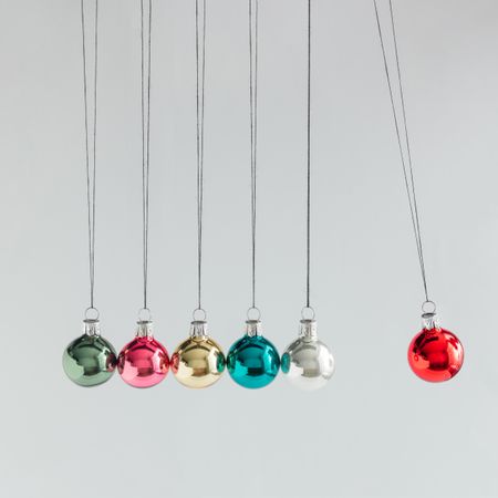 Colorful Christmas baubles decoration, on light background with copy space