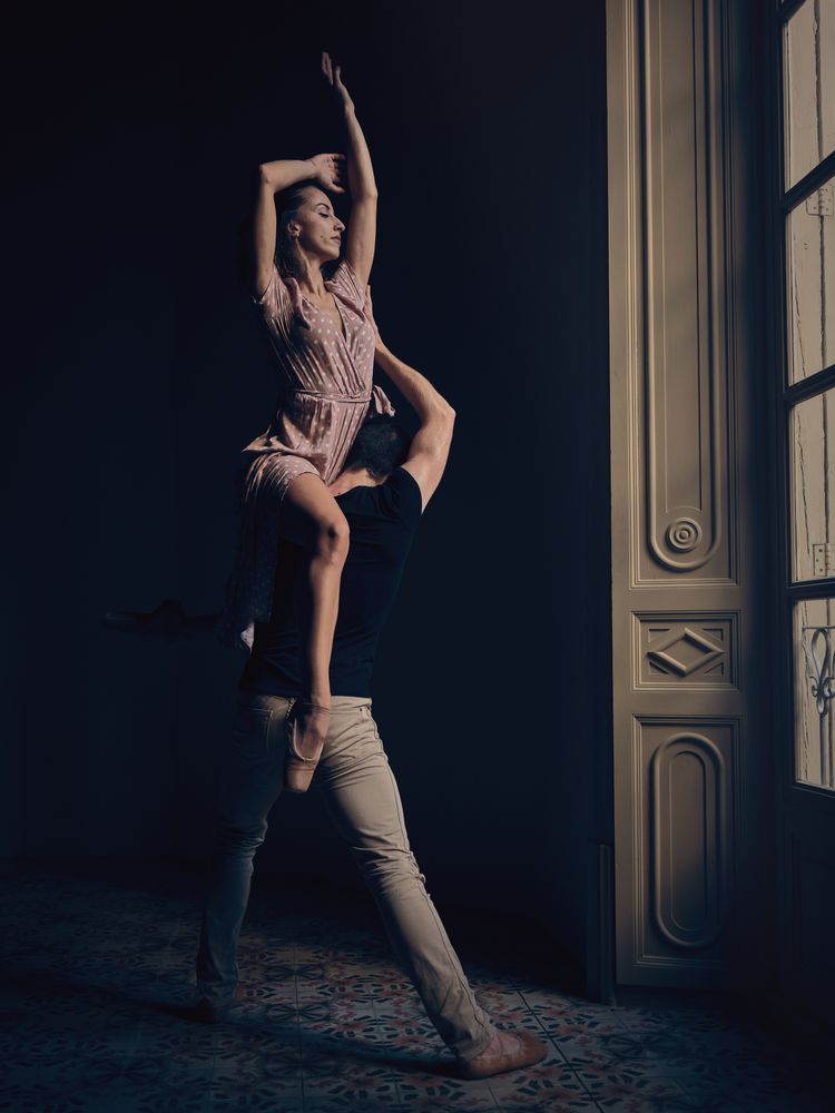 Couple dancing ballet in classic room