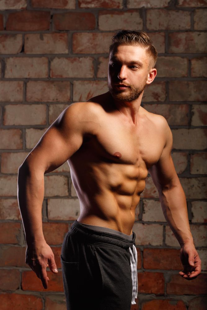 Weightlifter practicing poses ahead of competition