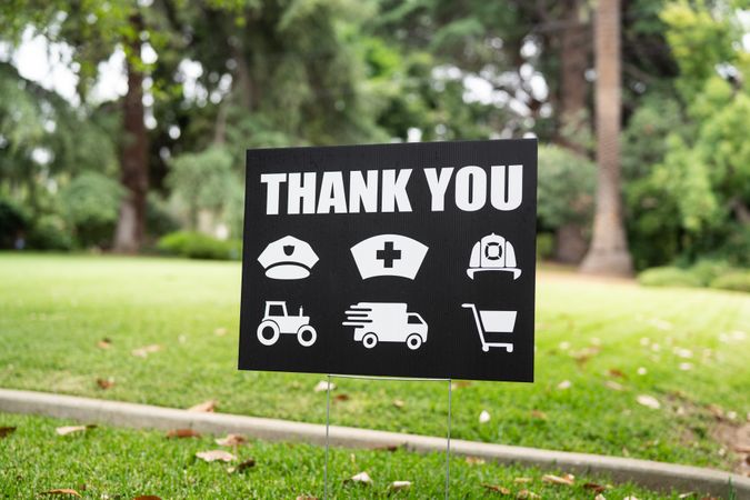 Thank you yard sign in grass for essential workers