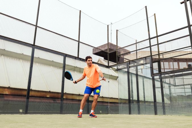 Young man playing paddle tennis