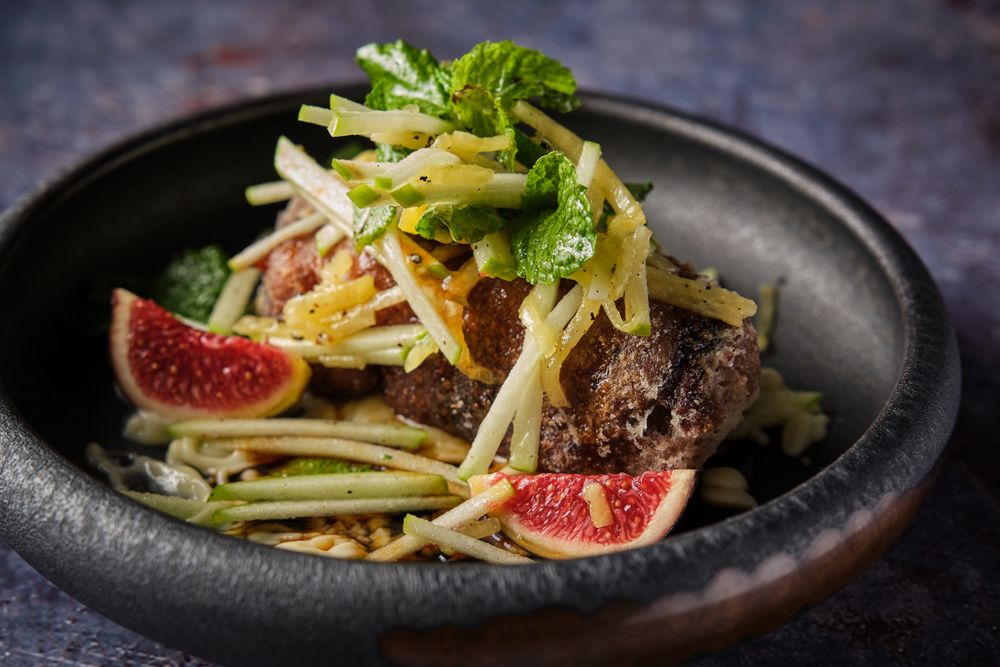 Tasty pig trotter with salad served in plate