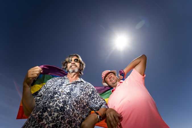 Excited gay couple in desert