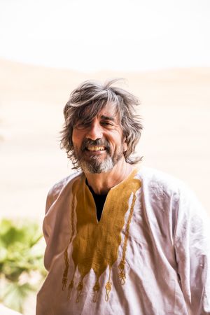 Portrait of adult man in desert