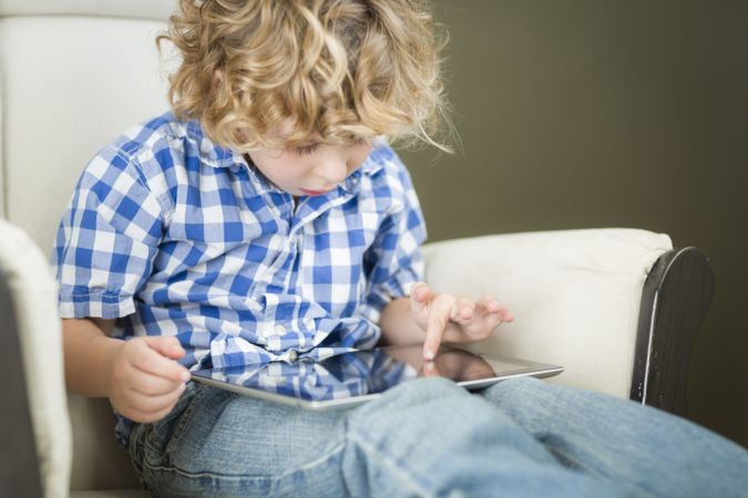 Young Boy Using His Computer Tablet