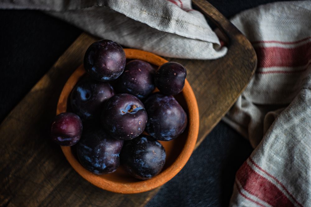 Top view of bowl of plums