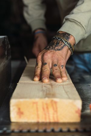 Crop carpenter working with wood in workshop