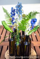 Summer flower composition with vases of blue flowers bE9PnN