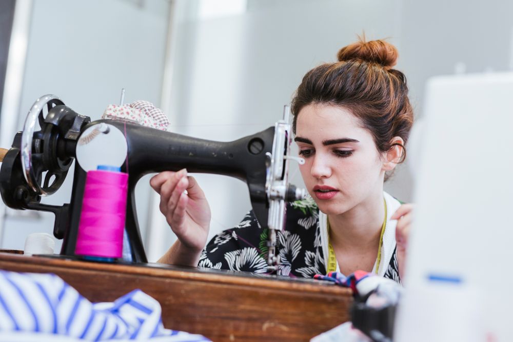 Woman in a sewing school