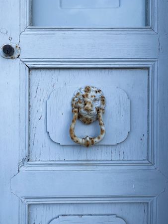Patmian knocker close up of rusting lionshead