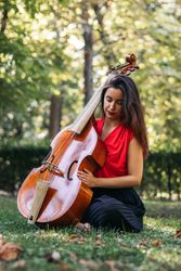 Woman with cello in a park