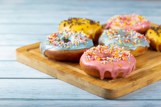 Delicious assorted colorful donuts on the table.