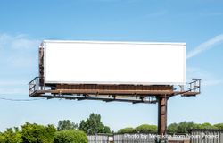Digital billboard mockup next to road against a clear blue sky 0yLy7b