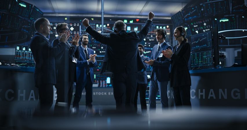 Team of Successful Stock Exchange Brokers Celebrating a Profitable Investment Bid on a Securities Market.