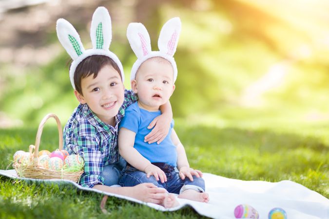 Boys Outside in Park Playing with Easter Eggs