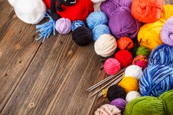 Balls of yarn on wooden table