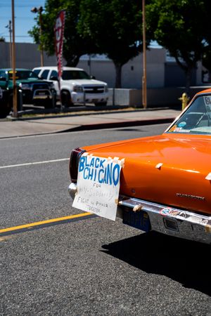 Los Angeles, CA, USA — June 7th, 2020: sign on back of car “Black Chicano” in solidarity for BLM