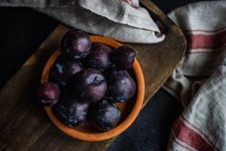 Top view of bowl of plums