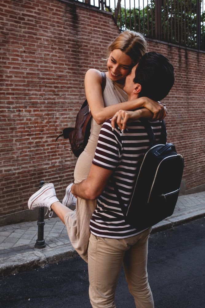 Happy couple having fun while walking in town