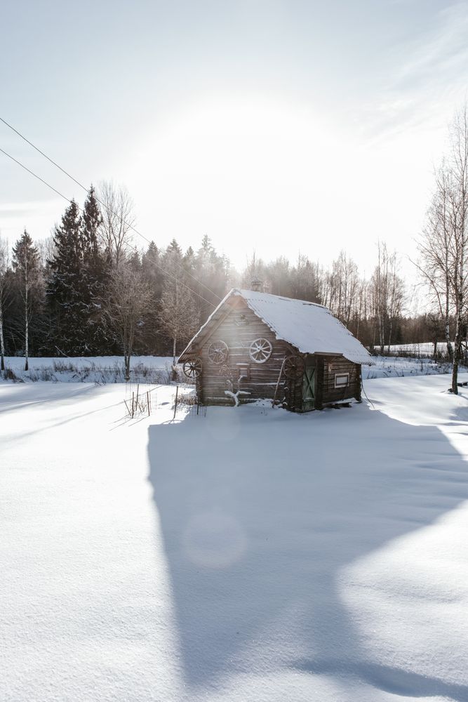 Old house between snow field