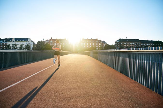 Bridge with woman running