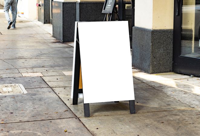 Blank a-frame mockup outside on street