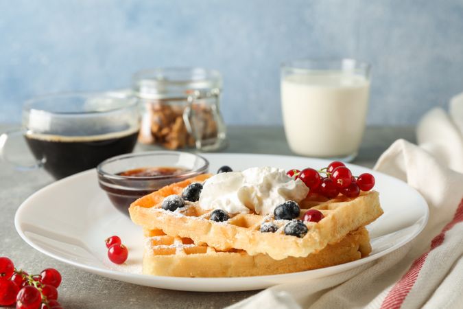 Composition of breakfast with belgian waffles, space for text