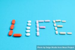Variation of pills making the word "LIFE" 5oDMez