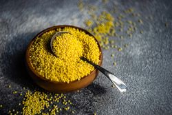 Bowl of millet grain with spoon