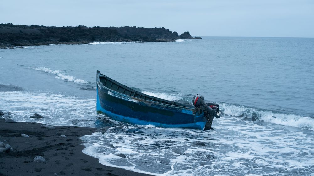 Boat lodged in beach sand