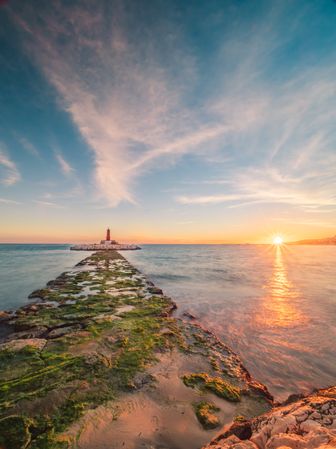 Rough path to islet with lighthouse