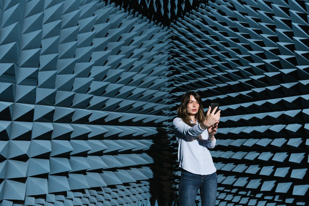 Woman in sound room taking selfie