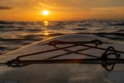Sunset over sea from paddleboard