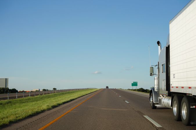 Roadway with driving transport in countryside