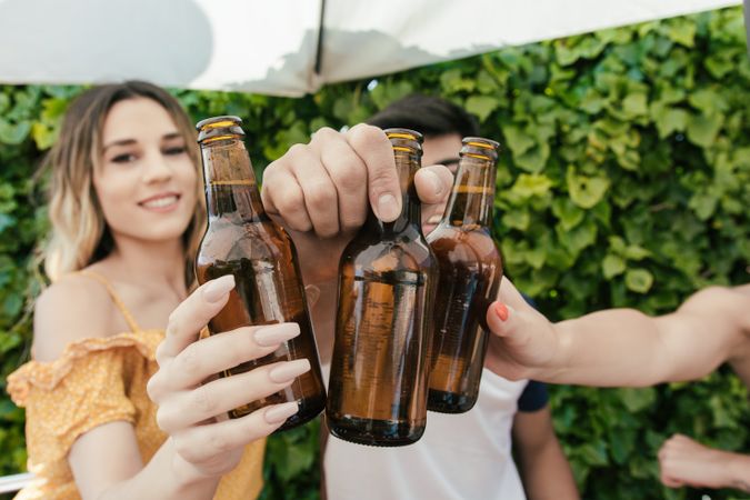 Group of friends drinking beer on the terrace of a bar
