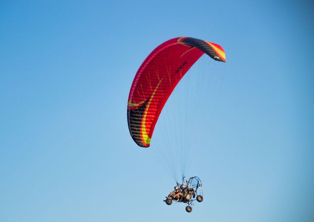 Two people parachuting under blue sky