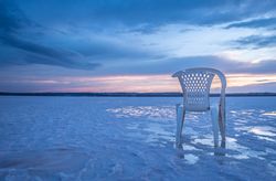 Chair on salt mine during sunset