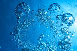 Vibrant azure water with bubbles