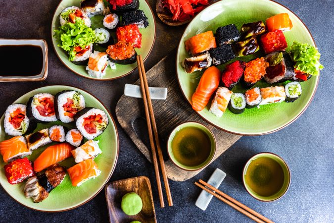 Plates of delicious sushi and sashimi