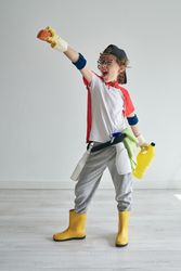 Energetic superhero in cleaner costume in studio