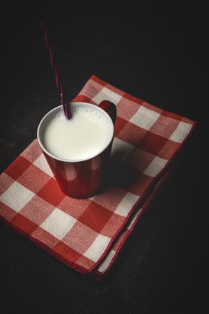 Cup of milk on table