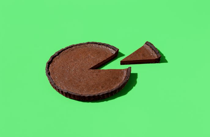 Chocolate pie isolated on a green background
