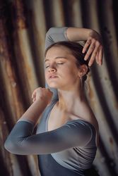 Young woman dancing ballet in tunnel