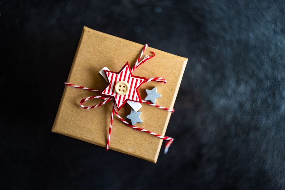 Top view of brown Christmas present with star decoration