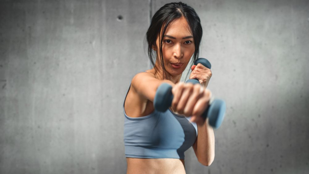 Online Workout Service: Strong Asian Female Training, Exercises with Dumbbells
