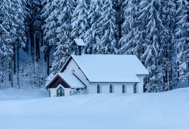 Winter landscape with a church minimalist in a deep snow nature, in the Bavarian Alps, Germany
