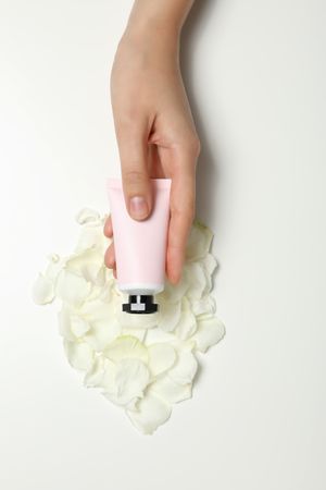 A jar of hand cream on a light background.