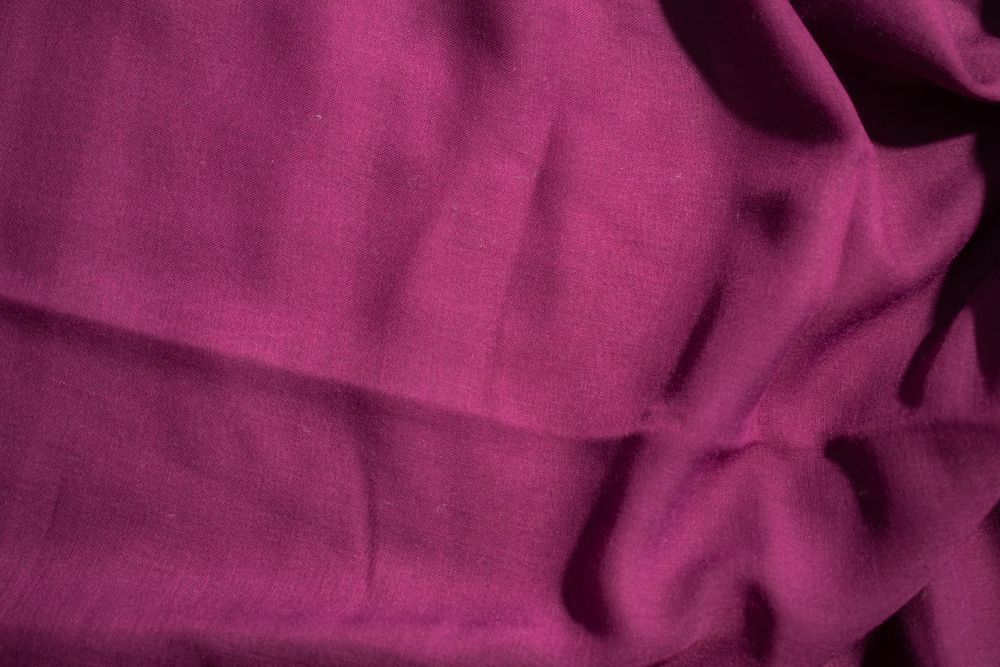 Soft purple fabric wavy crumpled background abstract with copy space