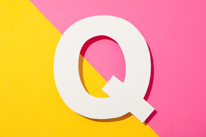letter Q on two color background, space for text