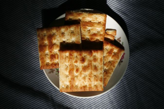 Top view of crackers on plate in morning light